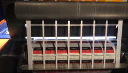 Automated label finishing and waste removal for high-volume sticker orders.